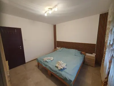 a bedroom with a bed with two towels on it at Cute 3-bedroom apartment at nice place in Pančevo in Pančevo