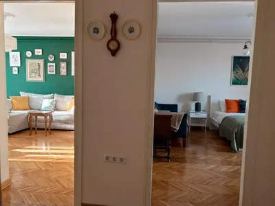 a open door to a living room with a couch at Ollio - Art of Dorcol in Belgrade