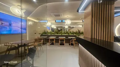 a restaurant with a dining room with tables and chairs at Zemun Golax Apartments in Belgrade