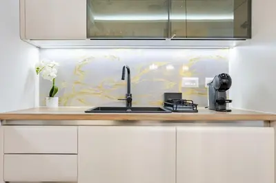 a kitchen with a sink and a coffee maker at Belgrade Waterfront - Beograd na Vodi - Sensa in Belgrade