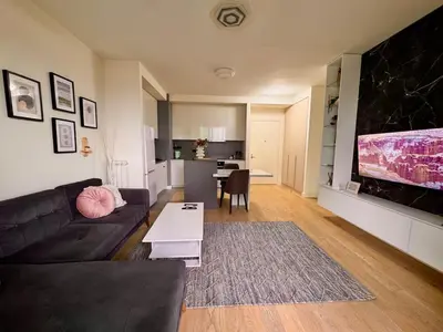 a living room with a couch and a table at BW Luna - stay inspired! in Belgrade
