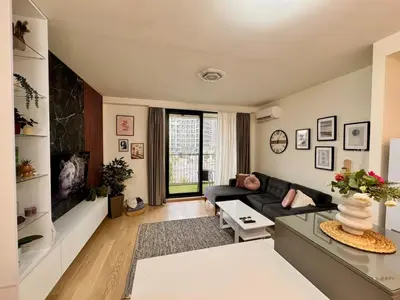 a living room with a couch and a tv at BW Luna - stay inspired! in Belgrade