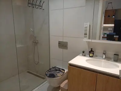 a bathroom with a shower and a sink and a toilet at 2 Beograd na Vodi Belgrade Waterfront posaljite poruku radi info o nacinu ulaska i preuzimanje kljuca in Belgrade