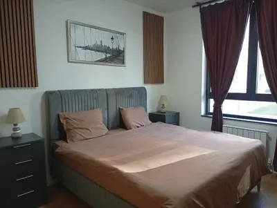 a bedroom with a large bed with two pillows at 2 Beograd na Vodi Belgrade Waterfront posaljite poruku radi info o nacinu ulaska i preuzimanje kljuca in Belgrade