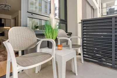 a group of chairs and a table in a room at Belgrade Waterfront - Beograd na vodi - Beograd in Belgrade