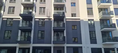 a facade of a building with windows and balconies at Belgrade Waterfront - Beograd na vodi - Beograd in Belgrade