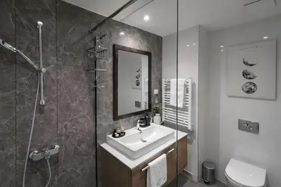 a bathroom with a sink and a shower at Modern Premium Studio - Belgrade Waterfront - Verde in Belgrade