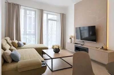 a living room with a couch and a tv at Echo Residence - Belgrade Waterfront in Belgrade