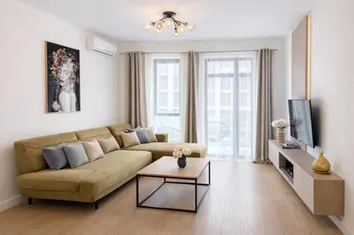 a living room with a couch and a table at Echo Residence - Belgrade Waterfront in Belgrade