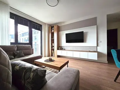 a living room with a couch and a tv at Echo Residence - Belgrade Waterfront in Belgrade