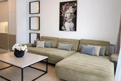 a living room with a couch and a table at Echo Residence - Belgrade Waterfront in Belgrade