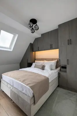 a bedroom with a large bed and a window at Giorgio Luxury Suites in Belgrade