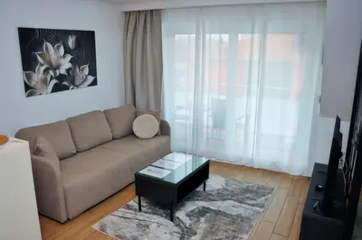 a living room with a couch and a coffee table at Giorgio Luxury Suites in Belgrade
