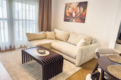 a living room with a couch and a table at Colorway Prime,Stari grad in Belgrade