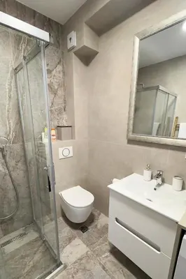 a bathroom with a shower and a toilet and a sink at Colorway Prime,Stari grad in Belgrade