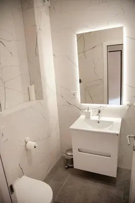 a white bathroom with a sink and a mirror at Colorway Prime,Stari grad in Belgrade