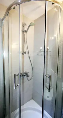a shower with a glass door in a bathroom at Apartment Grande centar with parking in Belgrade