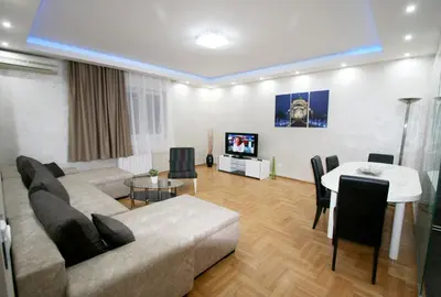 a living room with a couch and a table at Apartment Grande centar with parking in Belgrade