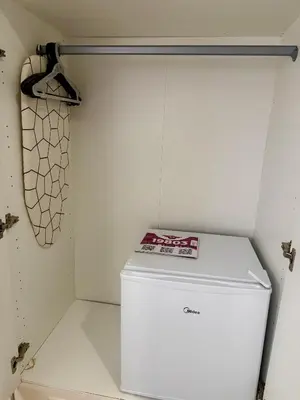 a refrigerator in a kitchen with a book on it at Teddy Luxury Suites in Belgrade