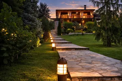 a stone path leading to a house with a building at Luxury Private Villa Estate Families & Groups Pool & Beach BBQ Garden & Yard Free Parking Near Center #Belgrade Villa in Belgrade