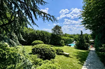 a park with a bench in the grass at Luxury Private Villa Estate Families & Groups Pool & Beach BBQ Garden & Yard Free Parking Near Center #Belgrade Villa in Belgrade