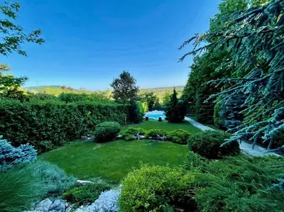 a garden with green grass and bushes at Luxury Private Villa Estate Families & Groups Pool & Beach BBQ Garden & Yard Free Parking Near Center #Belgrade Villa in Belgrade