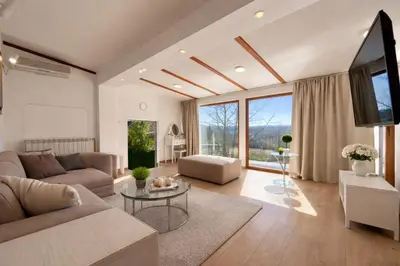 a living room with a couch and a table at Luxury Private Villa Estate Families & Groups Pool & Beach BBQ Garden & Yard Free Parking Near Center #Belgrade Villa in Belgrade