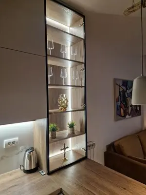 a mirror in a living room with a wooden table at W65 ElegantStay II in Belgrade
