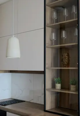 a kitchen with a glass door with a pendant light at W65 ElegantStay II in Belgrade