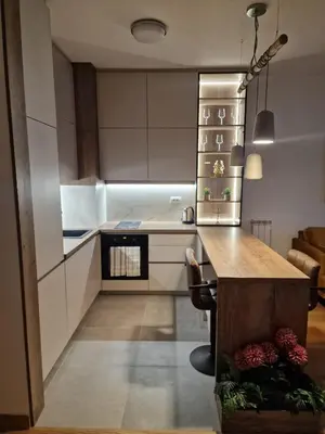 a kitchen with a island in the middle of a room at W65 ElegantStay II in Belgrade