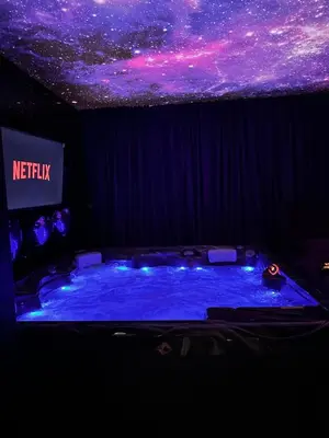 a stage with a starry sky on the ceiling at Flex Lux Spa Apartment Belgrade with Jacuzzi and Sauna in Belgrade