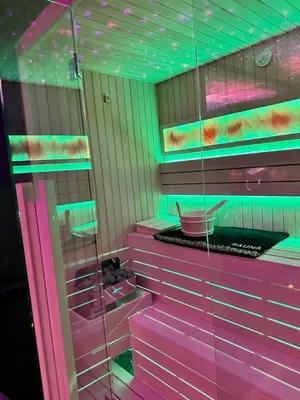 a pink bathroom with neon lights on the wall at Flex Lux Spa Apartment Belgrade with Jacuzzi and Sauna in Belgrade