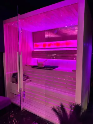 a refrigerator with purple lights in a room at Flex Lux Spa Apartment Belgrade with Jacuzzi and Sauna in Belgrade
