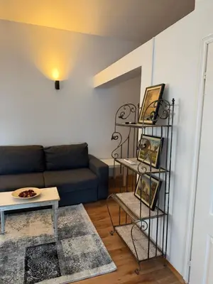 a living room with a couch and a table at Apartman Tara in Belgrade