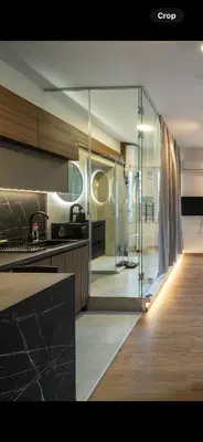 a kitchen with a glass wall in a room at Old Town Suites in Belgrade