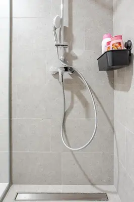a shower with a shower head in a bathroom at Belgrade Waterfront - Beograd na Vodi - Sensa 3 in Belgrade