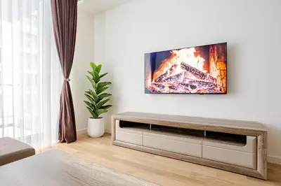 a living room with a tv on a wall at Belgrade Waterfront - Beograd na Vodi - Sensa 3 in Belgrade
