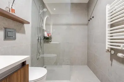 a bathroom with a shower and a toilet at Belgrade Waterfront - Beograd na Vodi - Sensa 3 in Belgrade