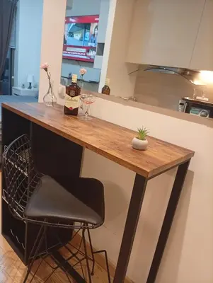 a kitchen counter with a bar in a kitchen at 1 Beograd na Vodi Belgrade Waterfront posaljite poruku radi info o nacinu ulaska i preuzimanje kljuca in Belgrade