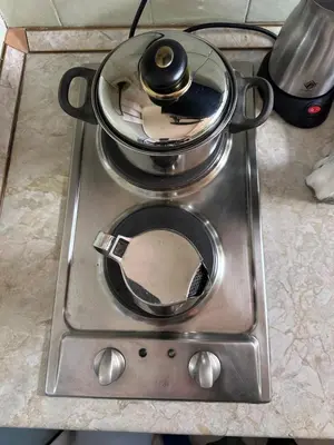a pot sitting on top of a stove at Suite Top 14 in Belgrade