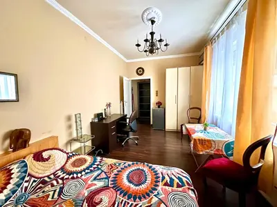 a bedroom with two beds and a room with a desk at Suite Top 14 in Belgrade