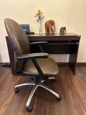 a desk with a chair in front of a desk at Suite Top 14 in Belgrade