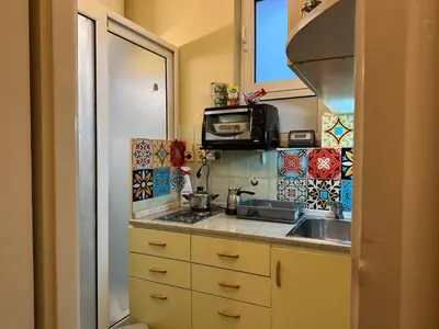 a small kitchen with a sink and a microwave at Suite Top 14 in Belgrade