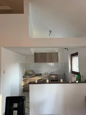 a kitchen with white walls and a counter top at Apartman Tara in Belgrade