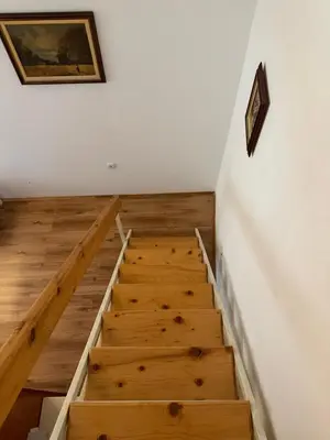 a staircase in a room with wooden floors at Apartman Tara in Belgrade