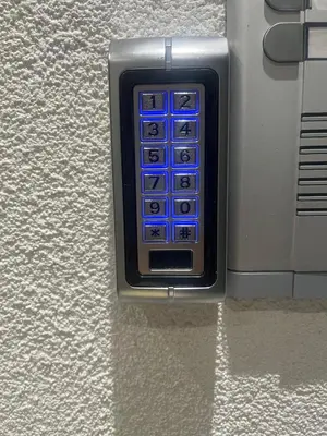 a remote control is attached to a wall at Harmony Apartment in Surčin