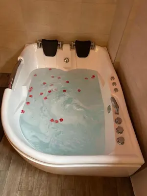 a bath tub with a cake in the middle at Urban Escape Zemun in Belgrade