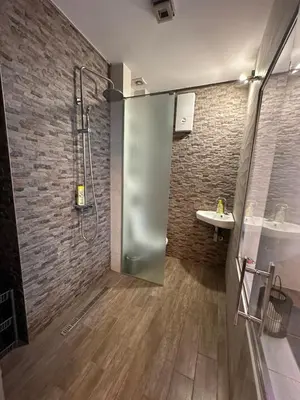 a bathroom with a shower and a sink at Urban Escape Zemun in Belgrade