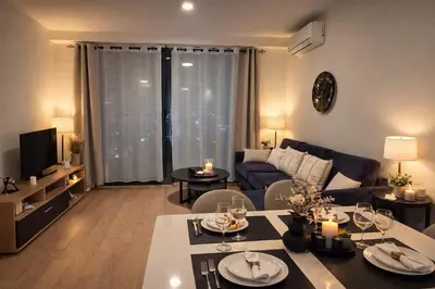 a living room with a couch and a table at Metropoliten Modern Apartment in Belgrade