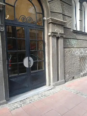 a black door on a building with a window at Moon in Belgrade